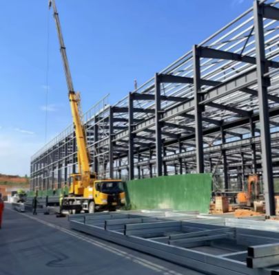 Prefabricated bolt‑assembled steel‑frame building industrial workshop logistics warehouse plant with crane beam mezzanine floor skylight and drainage system for industrial construction